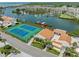 Aerial view of the tennis courts and boat docks in this waterfront community at 4358 Outrigger Ln, Tampa, FL 33615