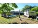 A spacious backyard features a screened-in pool and well-maintained lawn, perfect for outdoor gatherings and relaxation at 500 Hillpine Way, Brandon, FL 33510
