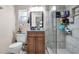 Bathroom features updated vanity with granite counters and a walk-in shower with tiled walls at 500 Hillpine Way, Brandon, FL 33510