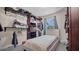 Bedroom with an open closet, queen sized bed and light colored walls and carpet at 500 Hillpine Way, Brandon, FL 33510