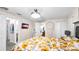 Bedroom with a large bed, wood-look flooring, closet, and ensuite bathroom for convenience and privacy at 500 Hillpine Way, Brandon, FL 33510