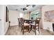 Dining room features a wooden table with chairs, ceiling fan, and sliding glass doors leading to the backyard at 500 Hillpine Way, Brandon, FL 33510