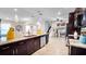 Modern kitchen featuring a large island, stainless steel appliances, and open layout to living area at 500 Hillpine Way, Brandon, FL 33510