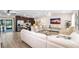 Open-concept living room and kitchen area with modern decor, stainless appliances, and ample seating at 500 Hillpine Way, Brandon, FL 33510