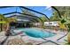 Relax in this screened-in pool area surrounded by lush landscaping and a charming patio, perfect for outdoor living at 500 Hillpine Way, Brandon, FL 33510