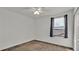 Bedroom with plush carpeting, a ceiling fan and natural light from a window makes this room comfortable and inviting at 5015 Brickwood Rise Dr, Wimauma, FL 33598