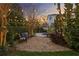Scenic backyard patio with comfortable seating and elegant string lights, ideal for outdoor gatherings at 5024 W Homer Ave, Tampa, FL 33629