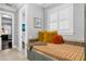 Bathroom with a built-in bench seat, colorful pillows and shutters on the window at 5024 W Homer Ave, Tampa, FL 33629