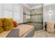 Bright bathroom showcasing a glass enclosed shower and a built-in bench at 5024 W Homer Ave, Tampa, FL 33629