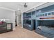 bedroom featuring custom built bunk beds and a built in ladder at 5024 W Homer Ave, Tampa, FL 33629