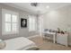 Comfortable bedroom featuring two windows and chic decor at 5024 W Homer Ave, Tampa, FL 33629