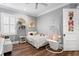 bedroom with hardwood floors, stylish decor, ceiling fan and bright natural light at 5024 W Homer Ave, Tampa, FL 33629