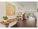 Elegant foyer with dark wood floors, console table, and stylish decor that leads to the living area at 5024 W Homer Ave, Tampa, FL 33629