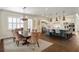 Open floor plan with dining area flowing into the gourmet kitchen with an island and stainless steel appliances at 5024 W Homer Ave, Tampa, FL 33629