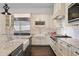 Gourmet kitchen featuring premium stainless appliances and granite countertops at 5024 W Homer Ave, Tampa, FL 33629