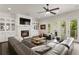 Bright living room with a fireplace, custom built-ins, and access to the outdoor balcony through sliding doors at 5024 W Homer Ave, Tampa, FL 33629