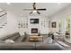 Spacious living room featuring a fireplace, custom built-ins, and comfortable leather seating at 5024 W Homer Ave, Tampa, FL 33629
