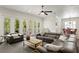 Bright living room with french doors leading to the outdoors, dining area and wood floors at 5024 W Homer Ave, Tampa, FL 33629