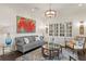 Comfortable living room with a gray sofa, decorative rug, built-in bookcase, and sophisticated lighting at 5024 W Homer Ave, Tampa, FL 33629