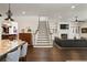 Bright living space with hardwood floors, staircase, and view of the living room and bar area at 5024 W Homer Ave, Tampa, FL 33629