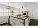 Second floor loft area with hardwood floors, shuttered windows, and bright lighting at 5024 W Homer Ave, Tampa, FL 33629