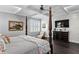 Open main bedroom featuring a coffered ceiling, dark wood floors, and a four-poster bed at 5024 W Homer Ave, Tampa, FL 33629