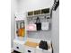 Clean mudroom featuring a white storage bench with hooks, shelves, and a cabinet at 5024 W Homer Ave, Tampa, FL 33629