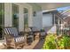 Covered porch featuring comfortable seating and a view of the neighborhood at 5024 W Homer Ave, Tampa, FL 33629