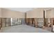 Unfinished basement showcasing concrete walls, wooden support beams, and an open doorway for customizable design at 535 Johns Pass Ave, Madeira Beach, FL 33708