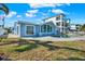 Exterior showcasing a luxurious home with pool, manicured lawn, and beautiful architectural design at 535 Johns Pass Ave, Madeira Beach, FL 33708