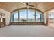 Open-concept living area featuring a large arched window overlooking the water and dock at 535 Johns Pass Ave, Madeira Beach, FL 33708