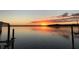 Picturesque sunset over the water, creating a serene ambiance with calm waters reflecting the colorful sky at 535 Johns Pass Ave, Madeira Beach, FL 33708