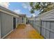 Private backyard with tile patio, wood steps and an outdoor shower with a privacy fence at 5601 2Nd N Ave, St Petersburg, FL 33710