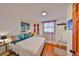 Bright bedroom featuring wood floors and colorful decor at 5601 2Nd N Ave, St Petersburg, FL 33710