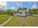 Well-maintained home with gray siding, a stone pathway, and a neatly manicured lawn at 5601 2Nd N Ave, St Petersburg, FL 33710