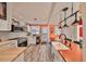 Well-lit kitchen with stainless appliances, center island with wooden countertop and ample cabinet space at 5601 2Nd N Ave, St Petersburg, FL 33710