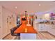 Modern kitchen features a large center island with bar seating and stainless steel appliances at 5601 2Nd N Ave, St Petersburg, FL 33710