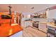 Modern kitchen with stainless steel appliances, wood countertops, and decorative details at 5601 2Nd N Ave, St Petersburg, FL 33710