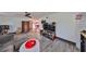 Open-concept living room with modern flooring and entertainment area at 5601 2Nd N Ave, St Petersburg, FL 33710
