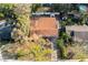 Aerial view of home featuring a large lot with mature trees at 6125 Liberty Ave, Temple Terrace, FL 33617