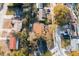 An aerial view displays the home nestled within a vibrant neighborhood with mature trees and clear street access at 6125 Liberty Ave, Temple Terrace, FL 33617