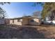 Backyard featuring a home's exterior and plenty of space to enjoy the outdoors at 6125 Liberty Ave, Temple Terrace, FL 33617