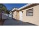 Exterior of home featuring a back entrance and concrete patio at 6125 Liberty Ave, Temple Terrace, FL 33617