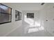Sun-drenched bedroom with modern windows and glossy tile flooring at 6125 Liberty Ave, Temple Terrace, FL 33617