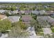 This is an aerial view of a neighborhood with mature trees and well-maintained lawns at 6308 Bridgevista Dr, Lithia, FL 33547