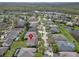 Birds-eye-view of a house in a residential neighborhood with serene ponds and tree-lined streets at 6308 Bridgevista Dr, Lithia, FL 33547