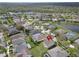 Real estate aerial view of a home in a neighborhood with water views and mature landscaping at 6308 Bridgevista Dr, Lithia, FL 33547