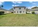Spacious backyard with lush green grass, perfect for outdoor activities at 6308 Bridgevista Dr, Lithia, FL 33547