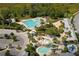 Aerial view of a community pool area, complete with recreational pool, seating and a waterfall feature at 6308 Bridgevista Dr, Lithia, FL 33547