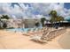 Resort-style community pool with comfortable lounge chairs and a scenic waterfall feature at 6308 Bridgevista Dr, Lithia, FL 33547